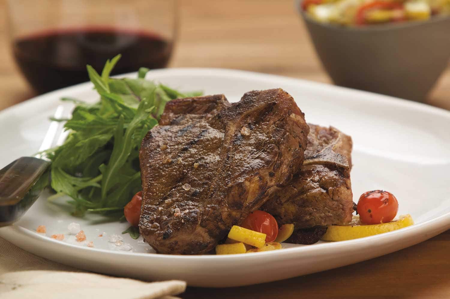 Garlic and Fennel Rubbed Loin Chops with Grilled Lemon and Tomato Compote Recipe