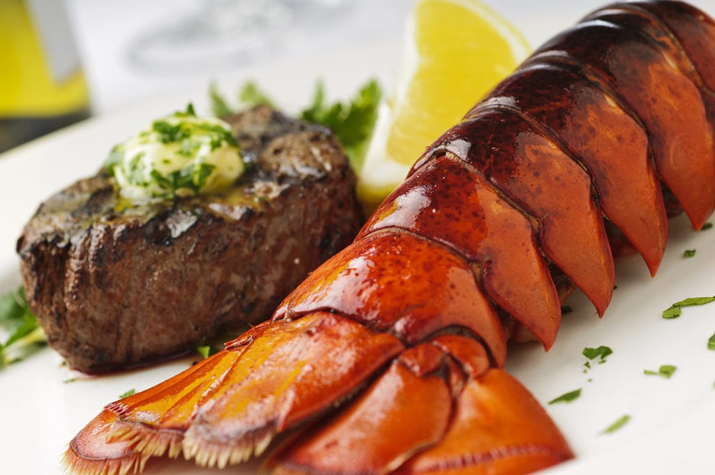 Surf and Turf Filet mignon with lobster tail and wine. Please see my portfolio for other food and drink related images.